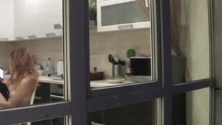 Watching my neighbour's naked hot GF goofing around in the kitchen